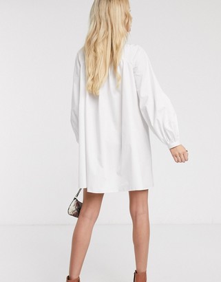 ASOS DESIGN mini cotton trapeze dress with button through in white