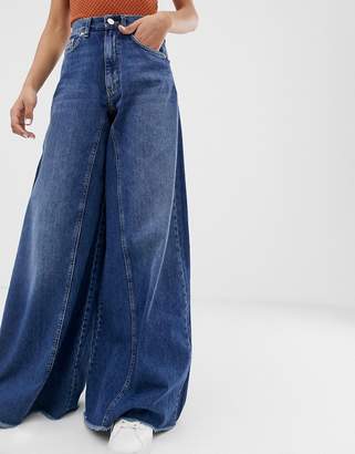 ASOS Tall DESIGN Tall wide leg jeans with inverted godet inserts in dark stone wash