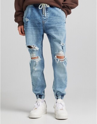 Bershka tapered jeans in mid blue - ShopStyle