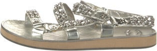 Chanel Leather Slides From the Spring/Summer 2022 Collection by Virginie Viard Metallic & Silver Interlocking CC Logo Quilted Pattern & Chain-Link Accent Chain-Link Accents Velcro Closure at Uppers Designer