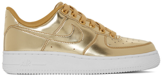nike shoes with gold logo
