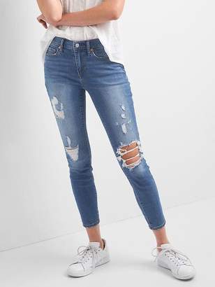 Mid rise destructed true skinny ankle jeans