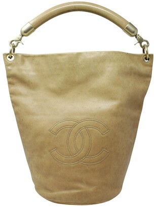 Vintage CHANEL campaign gold lamb leather hobo bucket bag with