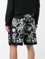 Thumbnail for your product : Givenchy tattoo print Bermuda shorts
