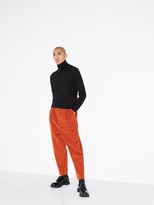 Thumbnail for your product : Raey Exaggerated Tapered-leg Corduroy Trousers - Dark Orange