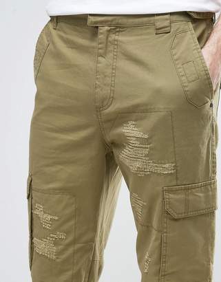 ASOS DESIGN Slim Cargo Pants With Rip & Repair Detail In Khaki