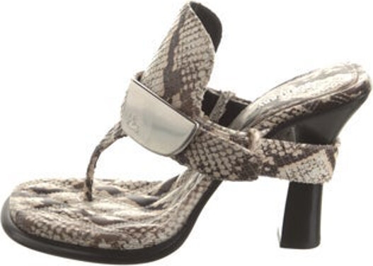Burberry Leather T-Strap Sandals Neutrals Animal Print Rubber Trim Buckle Closure At Uppers Includes Dust Bag Unfortunately, due to restrictions, this item may not be eligible for shipping in all areas.