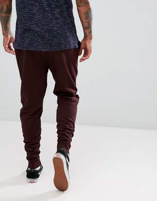 ASOS Tapered Joggers In Burgundy