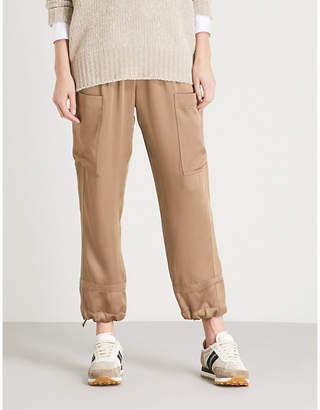 Brunello Cucinelli Belted high-rise tapered satin trousers