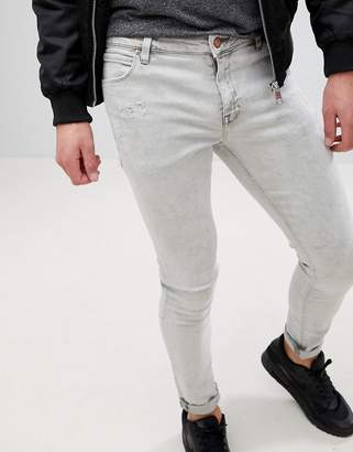 ASOS DESIGN Super Skinny Jeans In Light Gray With Abrasions