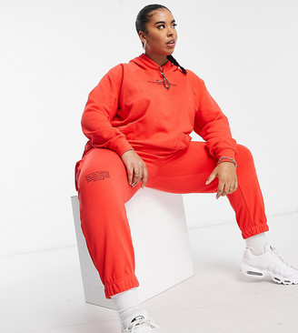 Nike Swoosh Plus fleece trackies in red