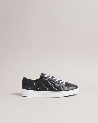 quilted trainers with magnolia studs in black