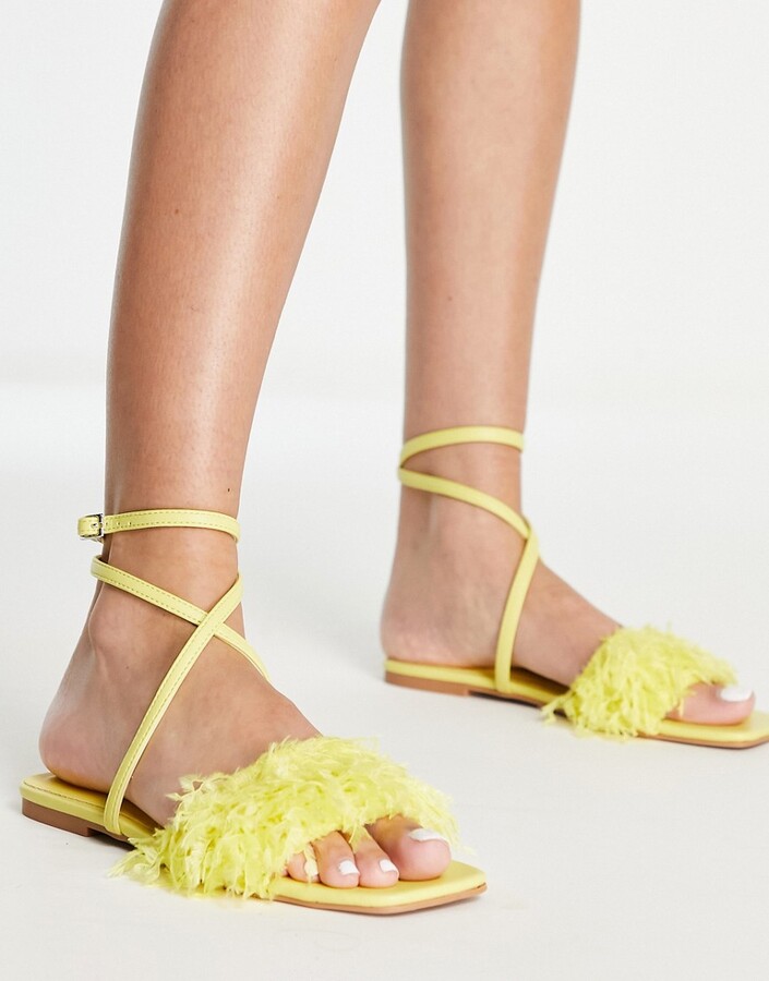 yellow flat sandals with bow