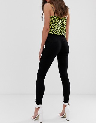 ASOS Tall DESIGN Tall Rivington high waisted jeggings with frayed knee rip detail