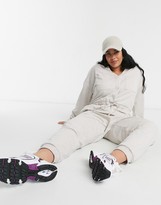Thumbnail for your product : ASOS Curve DESIGN curve open collar slouchy tie waist sweat jumpsuit in cream