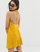 Thumbnail for your product : ASOS DESIGN mini halter swing dress with faux tortoiseshell ring detail