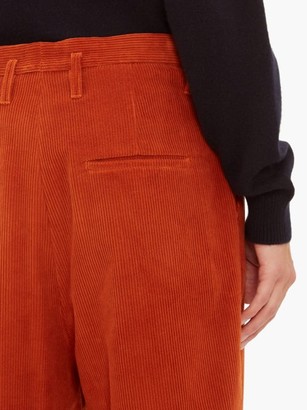 Raey Exaggerated Tapered-leg Corduroy Trousers - Dark Orange
