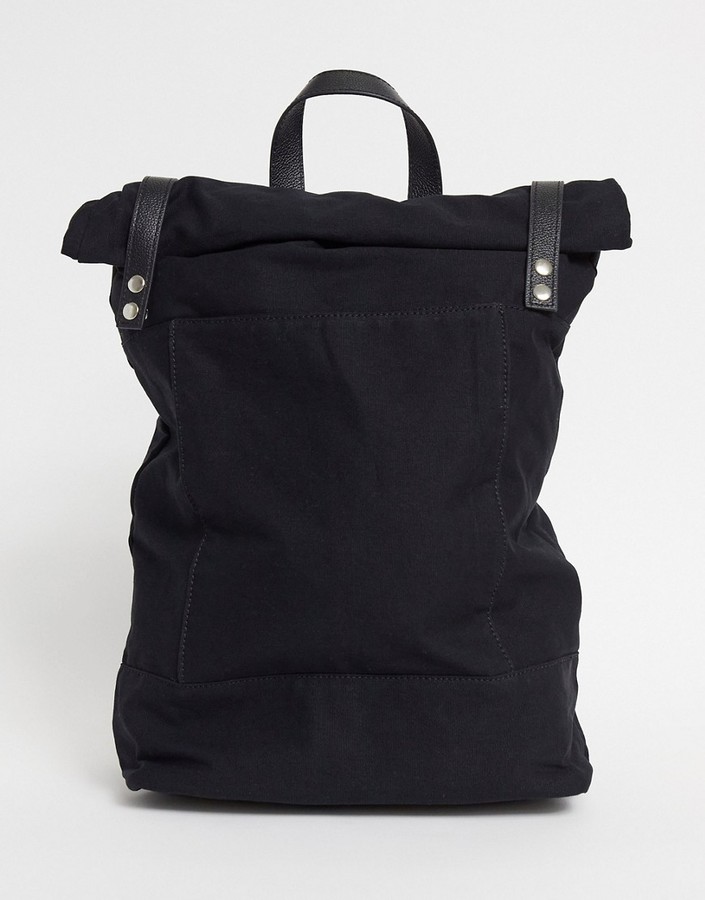ASOS DESIGN rolltop backpack in black canvas with leather trims ShopStyle
