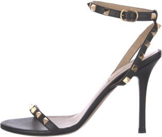 Valentino Leather Sandals Black Rockstud Accents Studded Accents Wrap-Around Straps & Buckle Closure at Ankles Unfortunately due to restrictions this item may not be eligible for shipping in all areas.