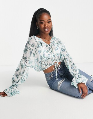ASOS DESIGN frill long sleeve dobby blouse wih tie front in blue floral -  ShopStyle Tops