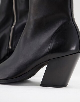 ASOS DESIGN heeled black leather chelsea boot with angled heel