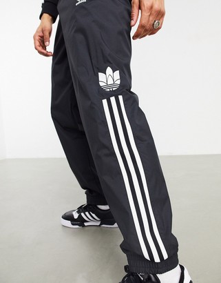 adidas 3D trefoil three stripe joggers in black - ShopStyle Trousers