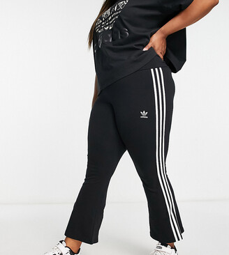 adidas Plus three stripe flare trousers in black - ShopStyle