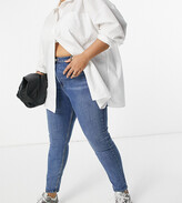 Thumbnail for your product : ASOS Curve DESIGN Curve high rise 'lift and contour' skinny jeans in midwash