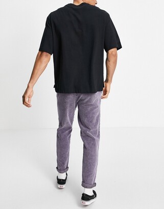ASOS DESIGN cord slim trousers with elasticated waist in purple acid wash