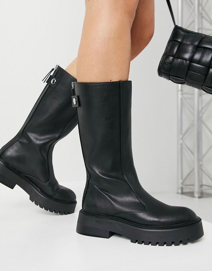 Bershka faux leather welly boot in black ShopStyle