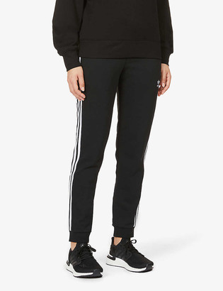 adidas Logo-print mid-rise cotton- and recycled-polyester blend jogging  bottoms - ShopStyle Pants