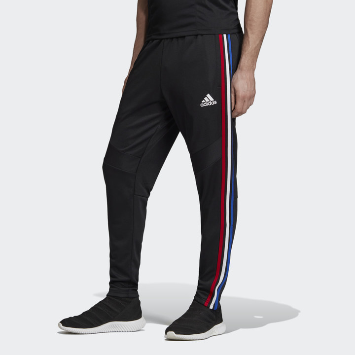 black adidas pants with red stripes