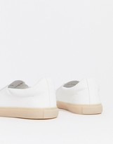 Thumbnail for your product : ASOS DESIGN slip on plimsolls in white leather look with gum sole