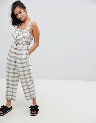 ASOS DESIGN Petite Jumpsuit With Elasticated Waist And Button Detail In Check