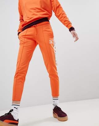 Puma Exclusive To ASOS Taped Side Stripe Track Pants In Orange