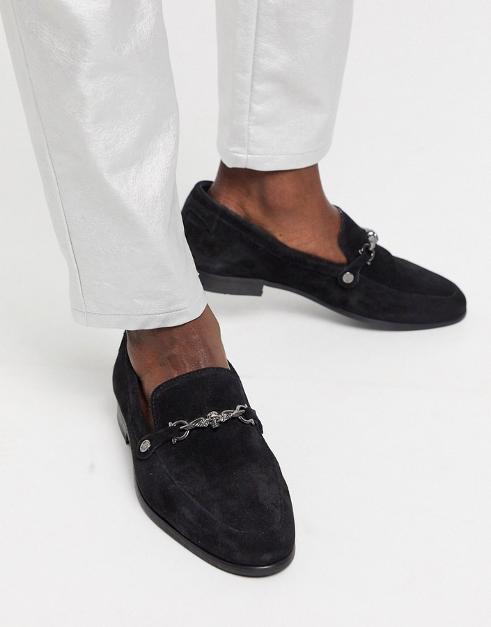 black suede loafers with gold buckle
