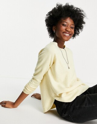 light yellow sweater