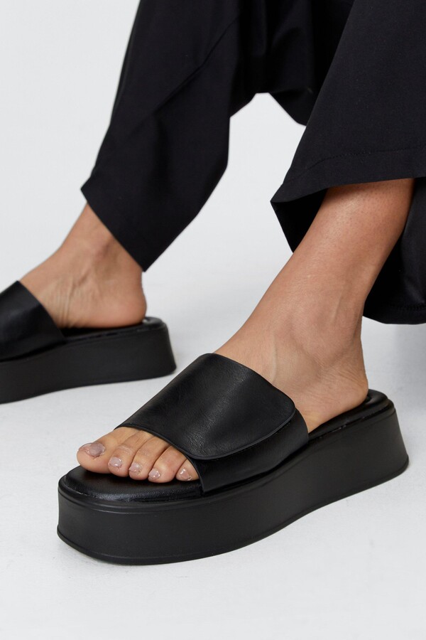 black leather flatforms