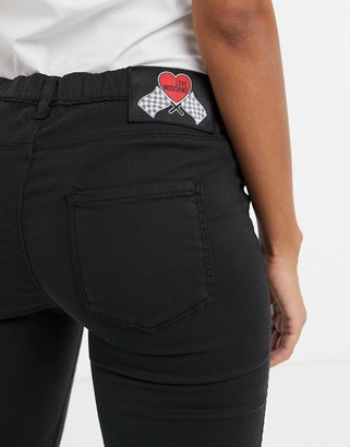 Love Moschino low rise skinny jeans in black