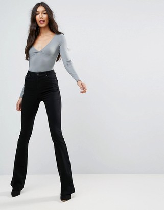 ASOS Tall DESIGN Tall bell flare jeans in clean black with pressed crease