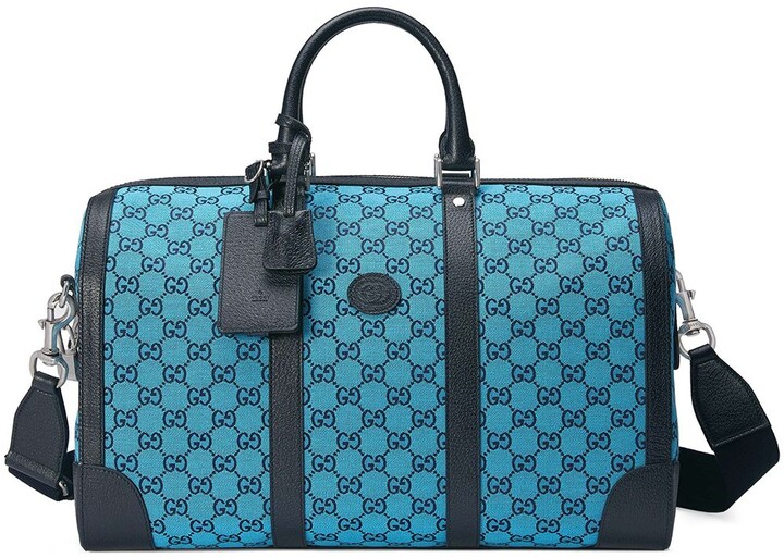 gucci supreme duffle bolsa