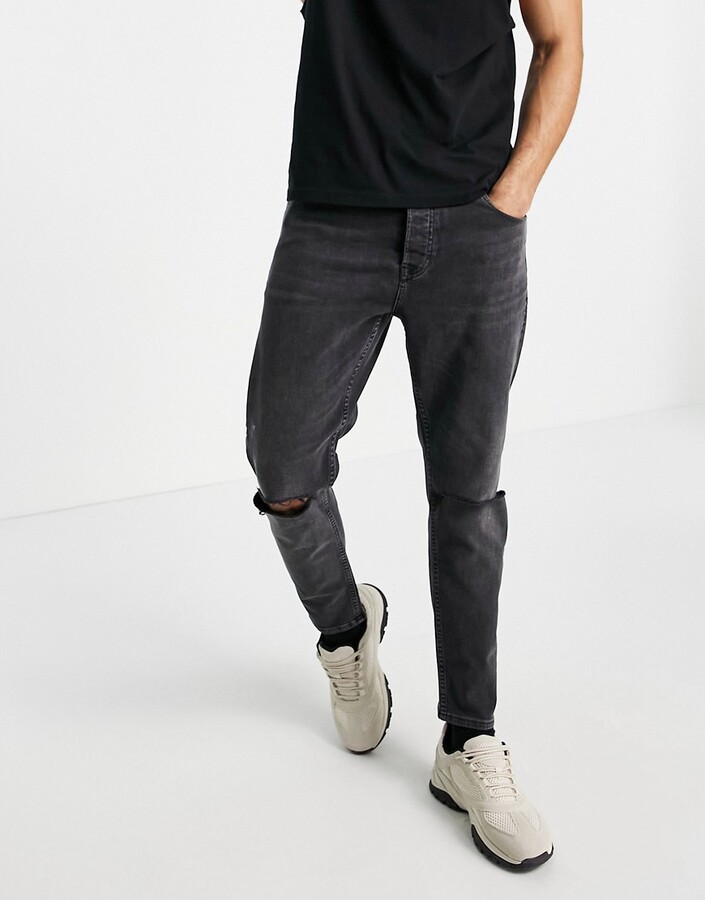 Topman stretch tapered jeans knee rip in washed black - ShopStyle