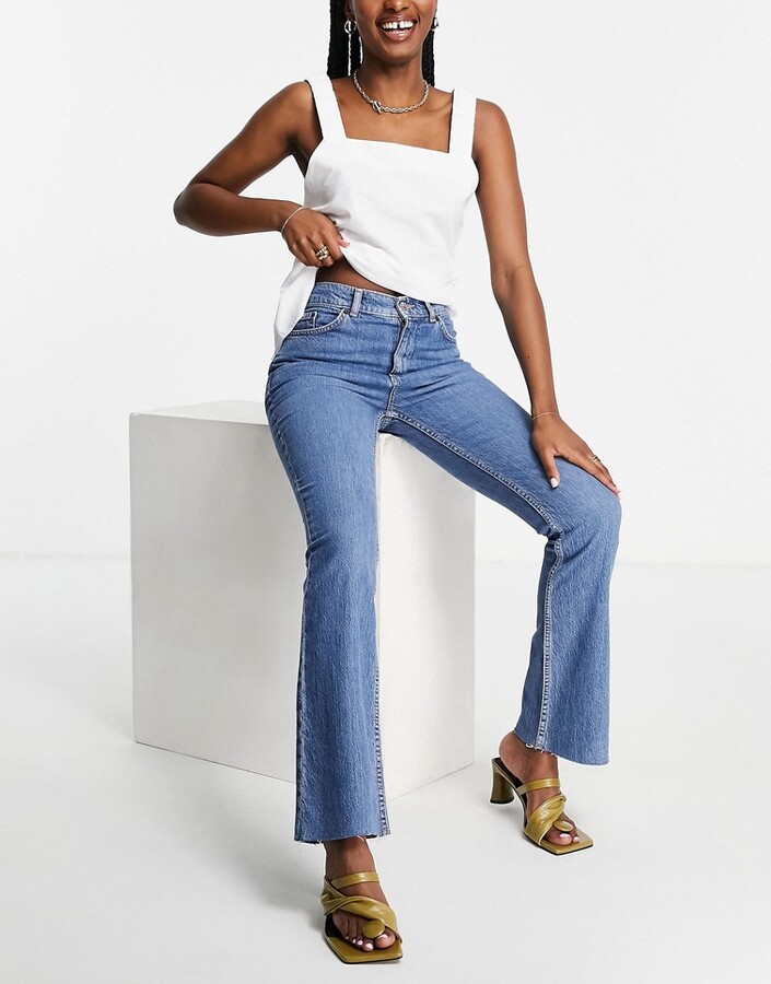 ASOS DESIGN high rise '70's' stretch flare jeans in midwash - ShopStyle