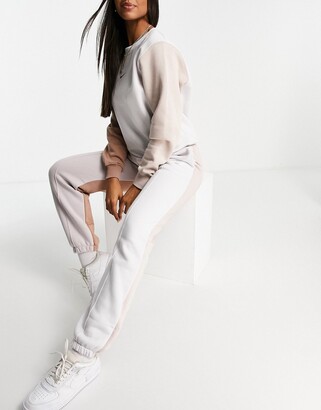 Nike Metallic Swoosh colour block joggers in neutrals - ShopStyle  Activewear Trousers