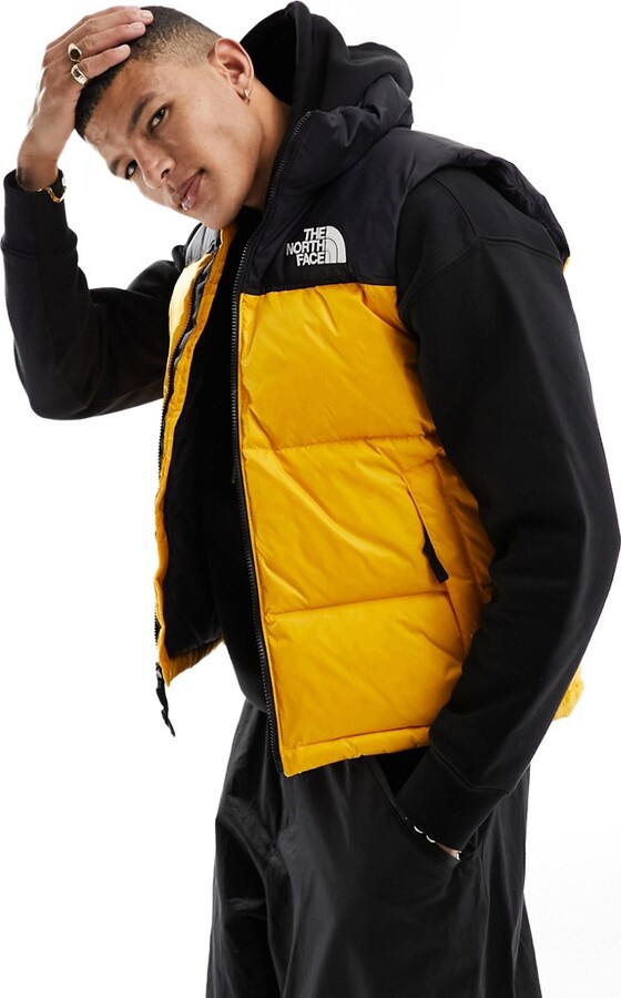 The North Face '96 Retro Nuptse down puffer gilet in yellow and
