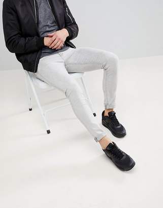 ASOS DESIGN Super Skinny Jeans In Light Gray With Abrasions