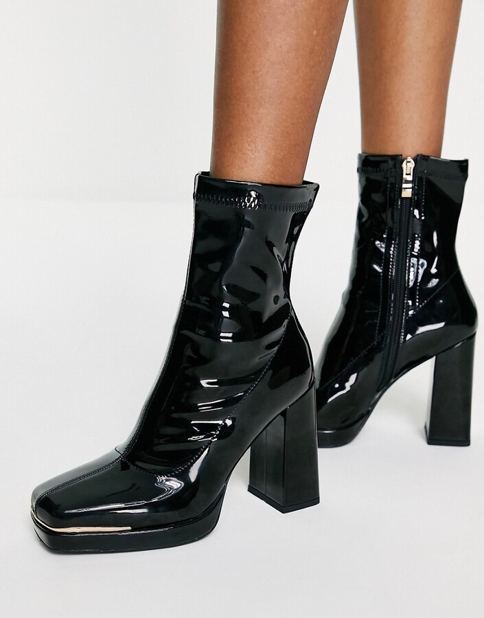 black vinyl platform boots