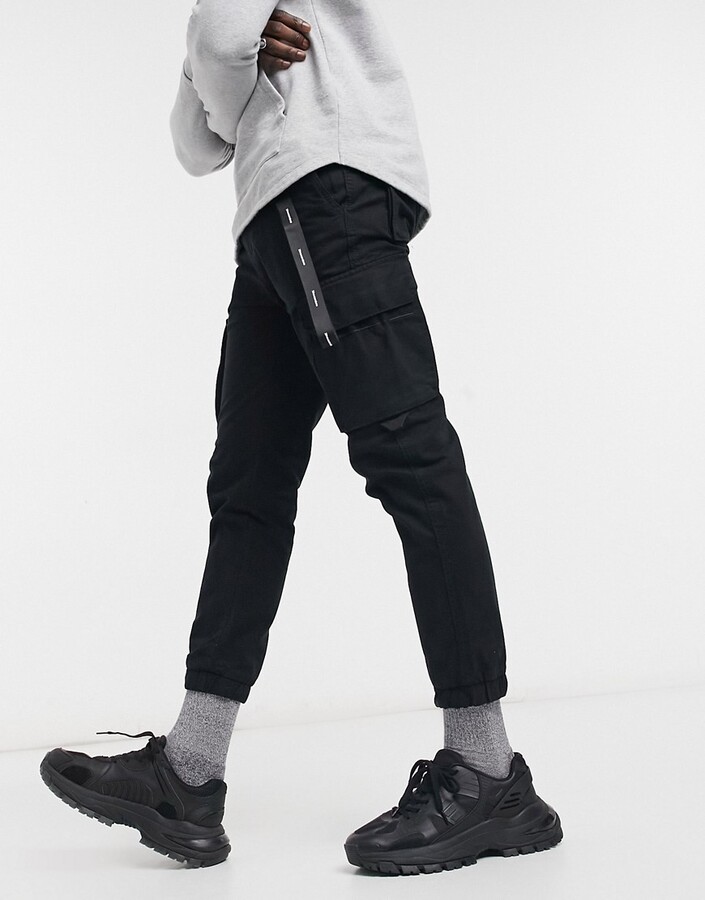 Bershka cargo pants with key chain in black - ShopStyle