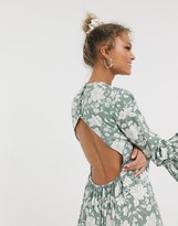 Thumbnail for your product : ASOS DESIGN fluted sleeve open back skater mini dress with lace inserts in floral print