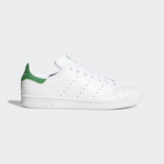 green and white adidas sneakers